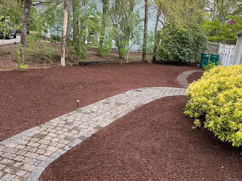 Professional landscaping and mulch beds on a Cape Cod property